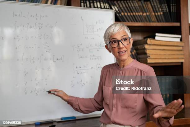 College Professor Explaining Math Stock Photo - Download Image Now - Teacher, Professor, Education