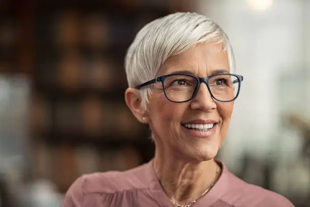 Photo of Senior woman smiling with eyeglasses