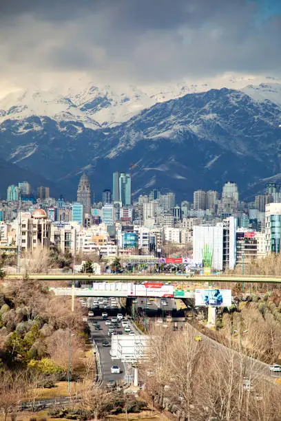 Tehran with mountain in background