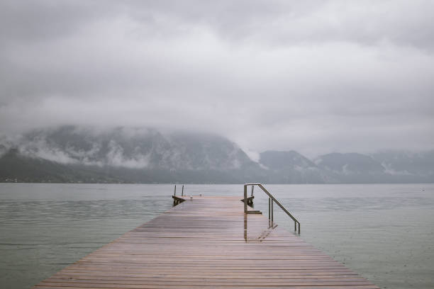 istock Traunsee lake. Wooden bridge and mountains 1201407588