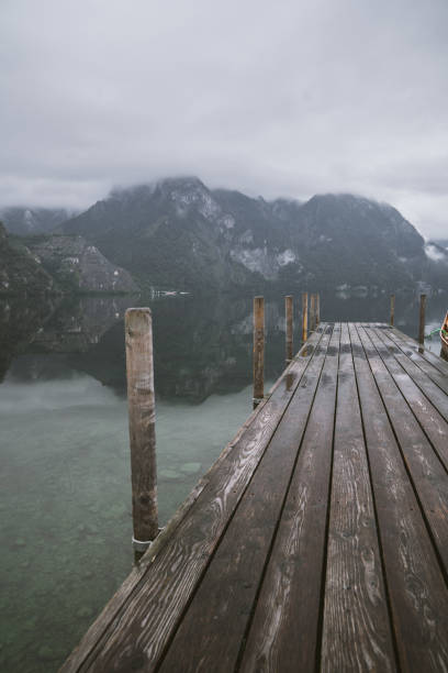 istock Traunsee lake. Wooden bridge and mountains 1201407589