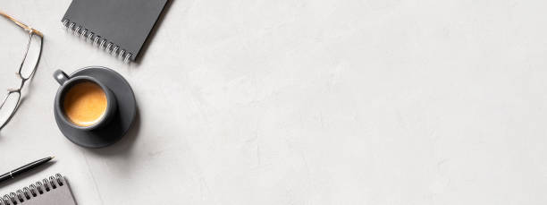 istock Office banner with cup of coffee espresso and open notepads 1201411053