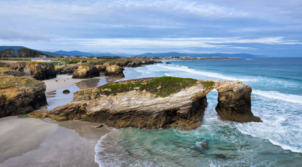 istock Natural stone arch on Playa de Las Catedrales, Spain 1201412373