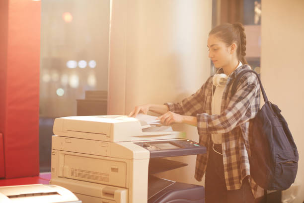 istock Woman making copy at university 1201412605