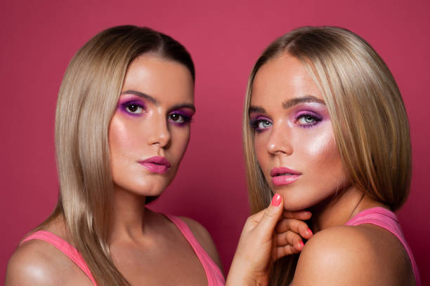 istock Nice women models with blonde hair and pink eyeshadow makeup 1201412763