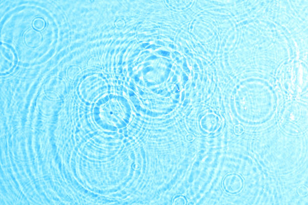 istock texture of splashing clean water on blue background 1201413695