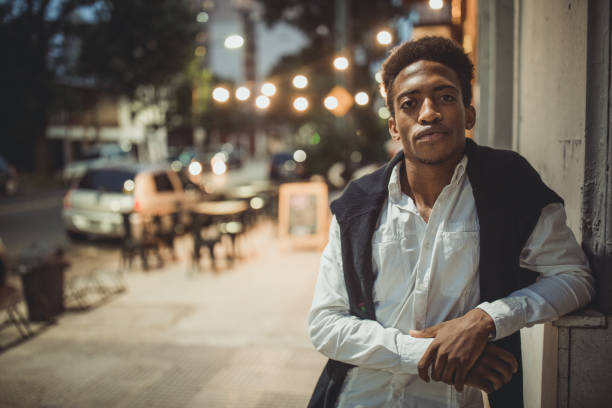 istock Black man standing on the street downtown 1201413810