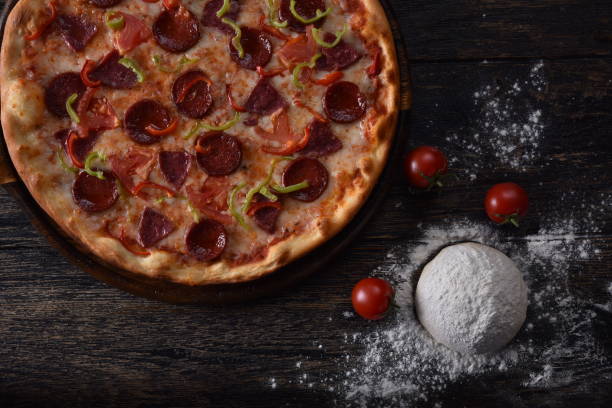 istock pizza dough and tomato next to the guilty pizza 1201413984