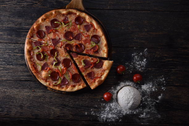 istock pizza dough and tomato next to the guilty pizza 1201414307