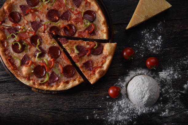 istock pizza dough and tomato next to the guilty pizza 1201414428