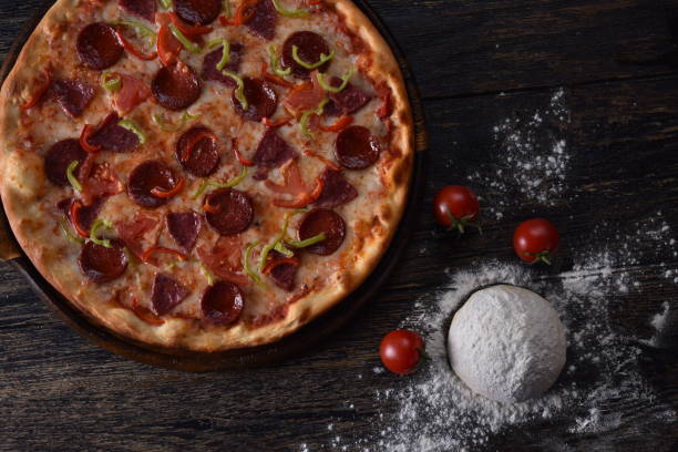 istock pizza dough and tomato next to the guilty pizza 1201414538