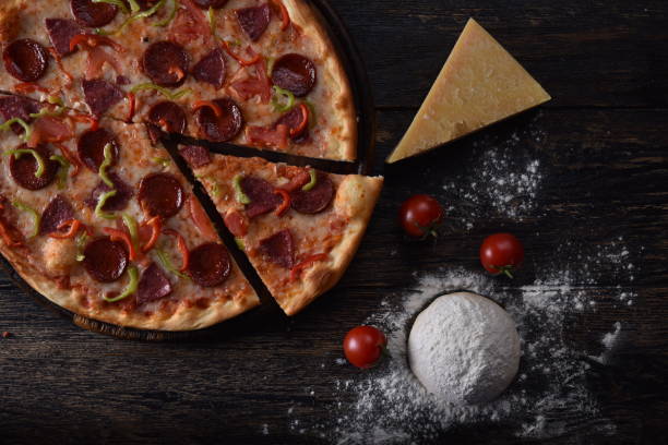 istock pizza dough and tomato next to the guilty pizza 1201415063