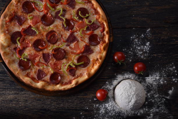 istock pizza dough and tomato next to the guilty pizza 1201415119
