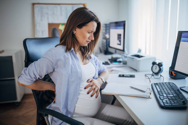 istock Pregnant woman having back pain 1201415451
