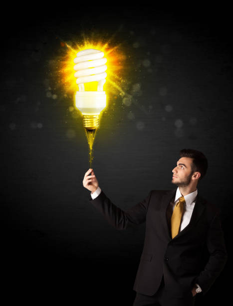 istock Businessman with an eco-friendly bulb 1201416974