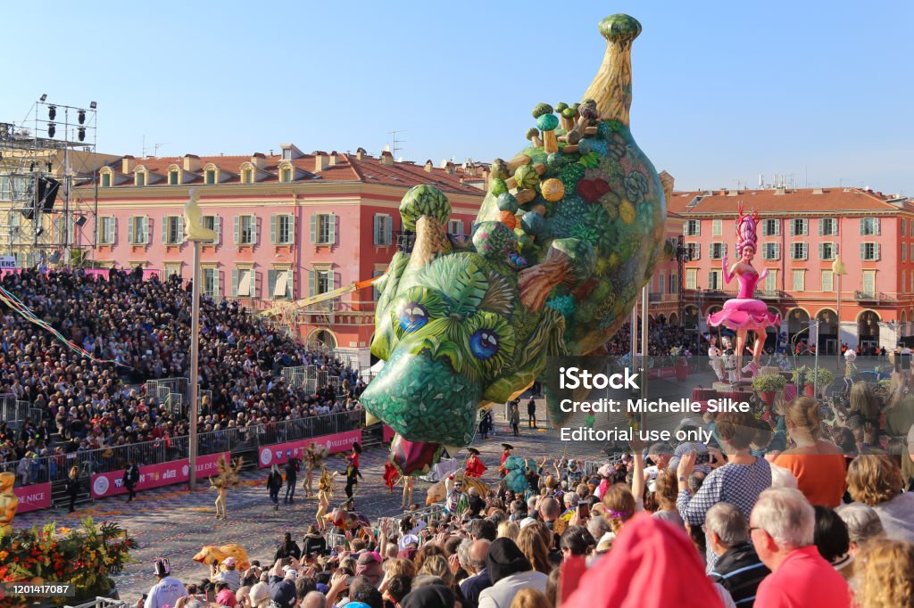 Carnaval de Nice, This years theme King of Cinema (ROI du Cinéma) - Giant parade balloons hover over the audience Nice, Cote d’Azur, France - February 20 2019: Carnaval de Nice, This years theme King of Cinema (ROI du Cinéma) -  Giant parade balloons hover over the audience Nice - France Stock Photo