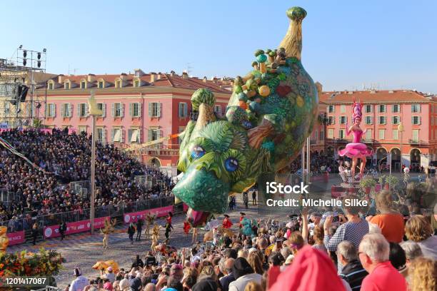 Carnaval De Nice This Years Theme King Of Cinema Giant Parade Balloons Hover Over The Audience Stock Photo - Download Image Now