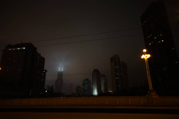 Shanghai buildings under cloudy skies at night stock photo
