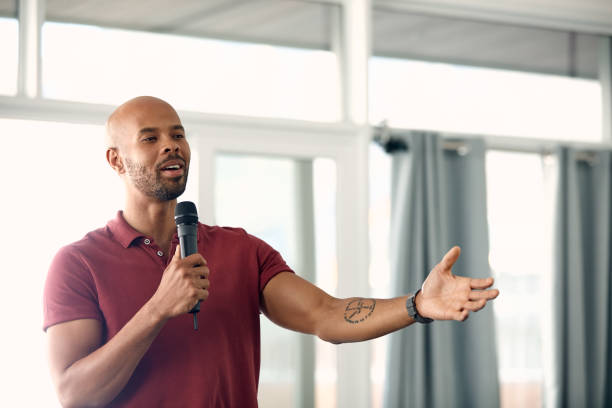 I have so much to share Cropped shot of a handsome young man speaking over a microphone television host stock pictures, royalty-free photos & images