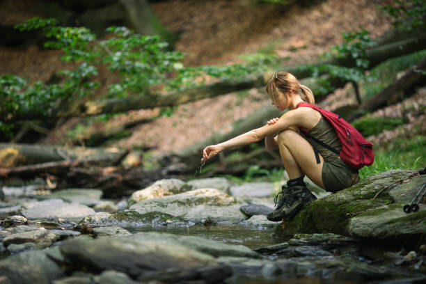 istock Young woman hiking alone 1201417714