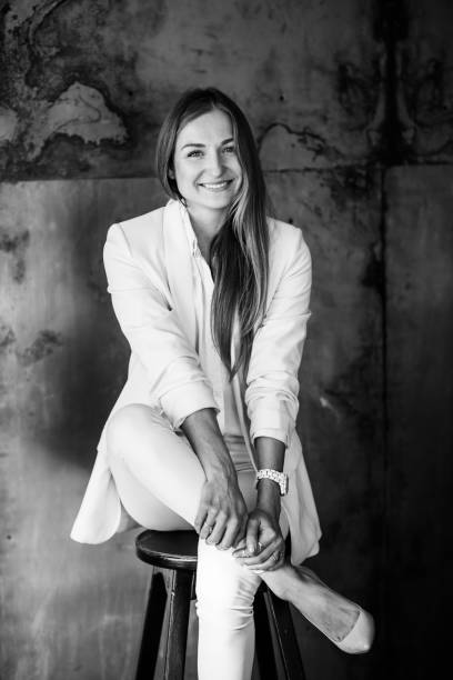 istock Elegant girl in a white suit 1201422135