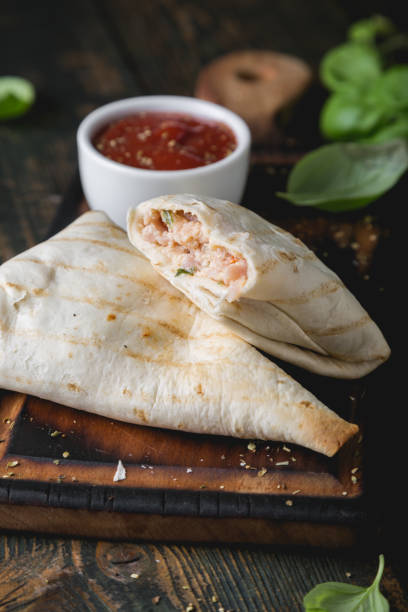 istock Tortilla wrapped meat and cheese sandwich 1201422260