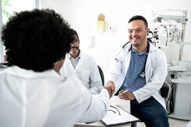 istock Special needs doctor on a handshake during conference / meeting 1201422296