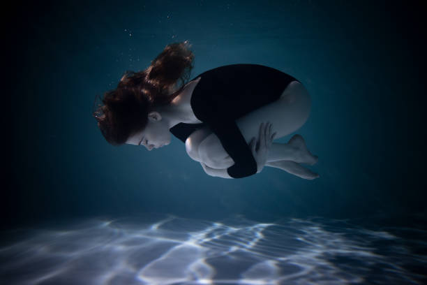 Young Slender Girl Underwater With A Cloth Water Magic Underwater  Photography Art Stock Photo - Download Image Now - iStock