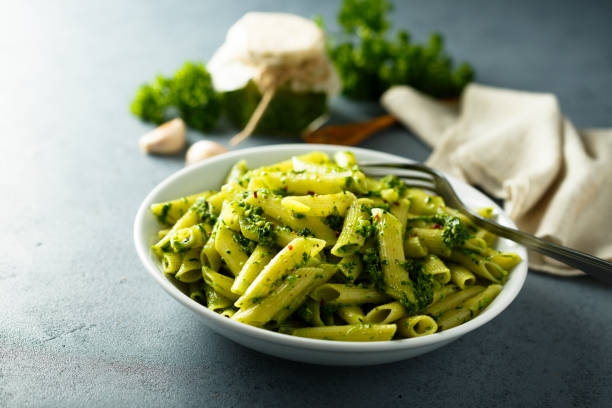 istock Pasta with pesto sauce 1201422557