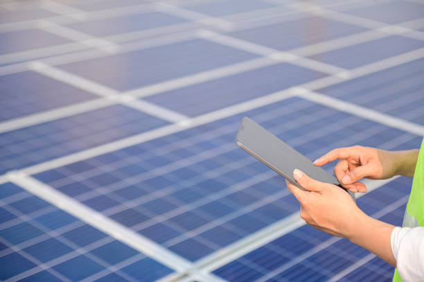 istock Engineer check Solar cell roof top on maintenance equipment at industry solar power, Renewable energy Concept. 1201422568