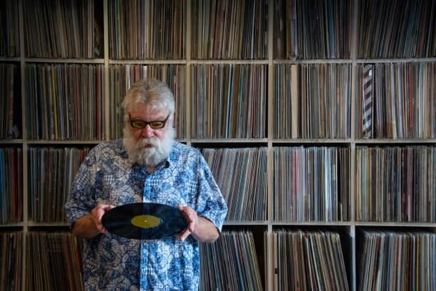 istock Record collector in front of his collection 1201424576