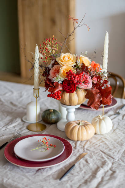 istock Serving plate with pumpkin and flowers as decor 1201425221