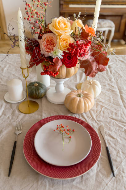 istock Table set with decor flowers and pumpkin on table 1201425226