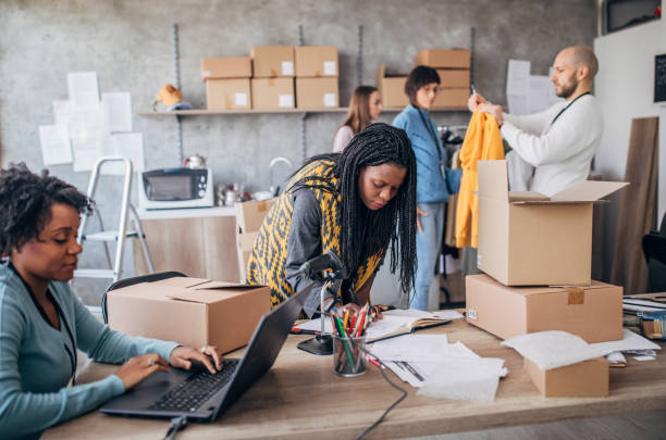 istock Diverse group of people arranging customers orders for drop shipping 1201426446