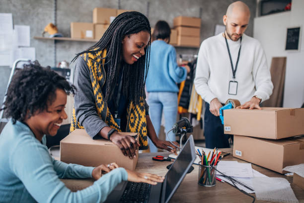 istock Diverse group of people arranging customers orders for drop shipping 1201426850