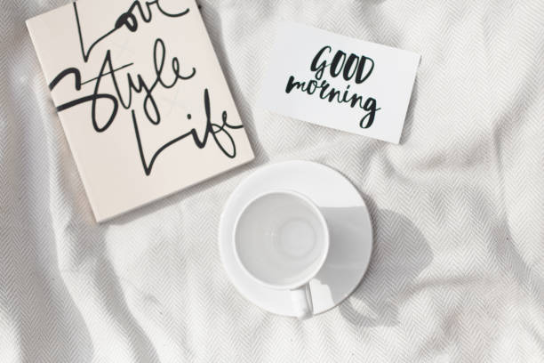 istock Empty white coffee cup next to a good morning sign 1201427327