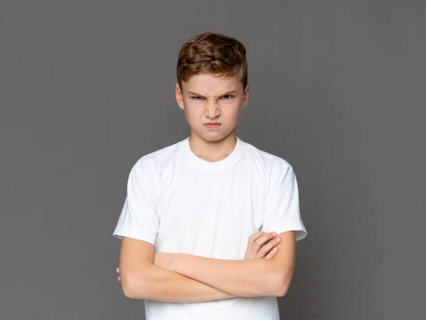 istock Angry teenager looking at camera with offence 1201428586