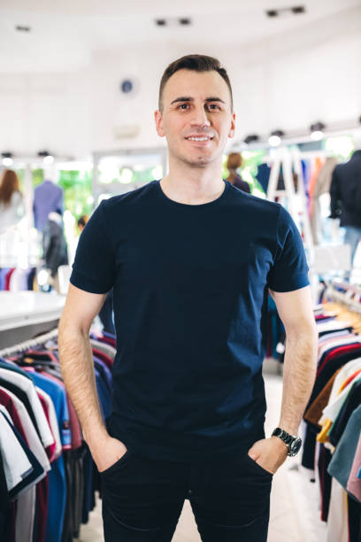 istock Man in clothing store 1201429247