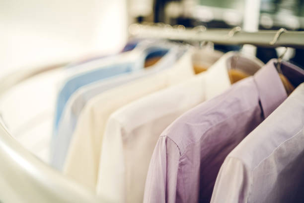 istock Men's shirts in clothing store 1201429474