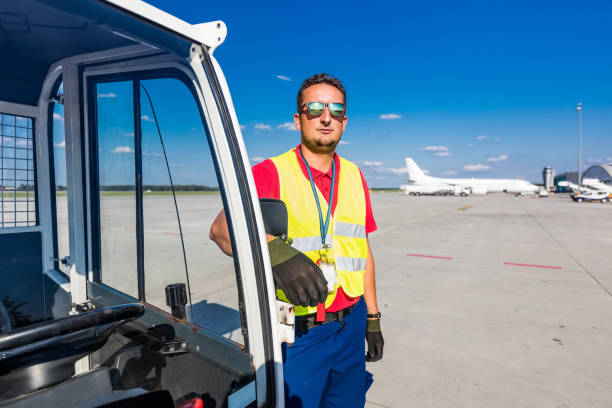 istock Airport ground service young man standing on the runway 1201429518