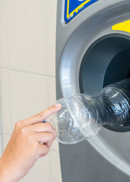 istock Plastic bottle is put into the deposit machine 1201429961
