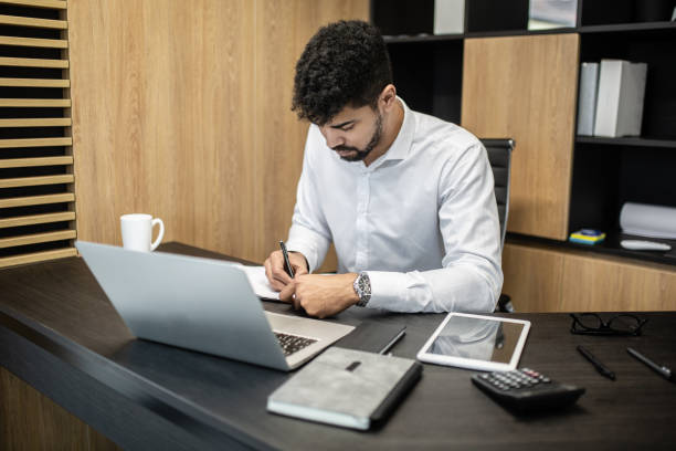 istock Businessmen is working in office 1201429975