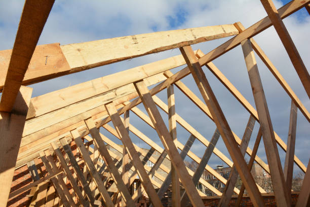 istock Wooden roof frame house construction. House rooftop wooden frame construction. 1201430040