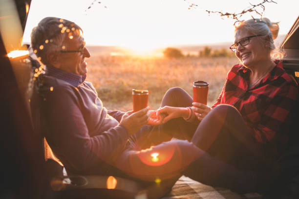 istock Senior couple outdoors with car 1201430769