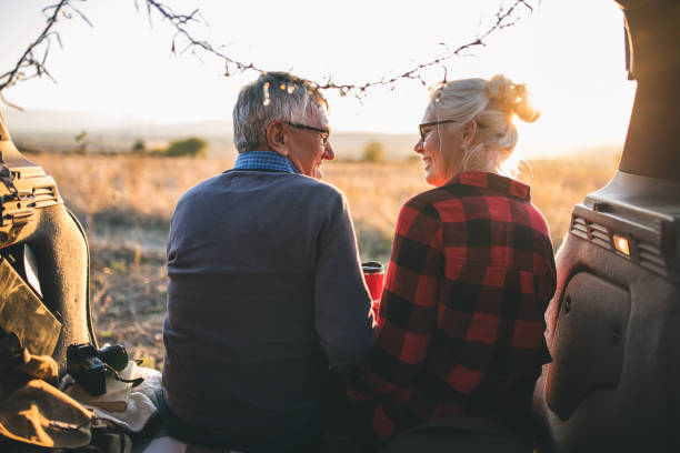 istock Senior couple outdoors with car 1201430827
