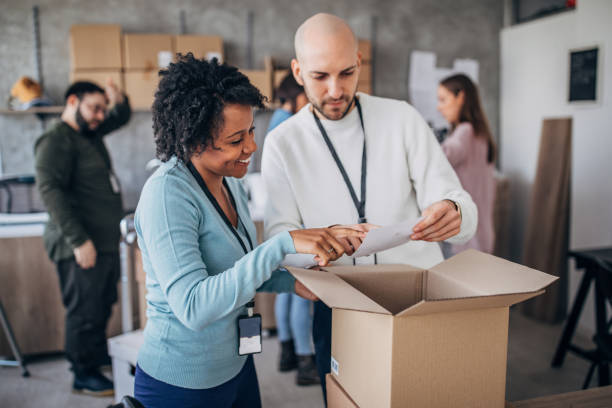 istock Diverse group of people arranging customers orders for drop shipping 1201431587