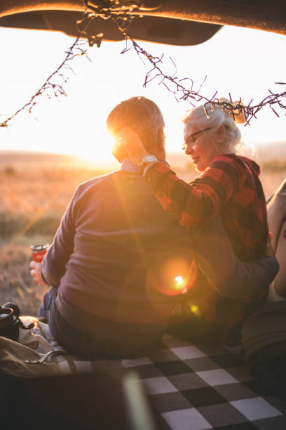 istock Senior couple outdoors with car 1201432626