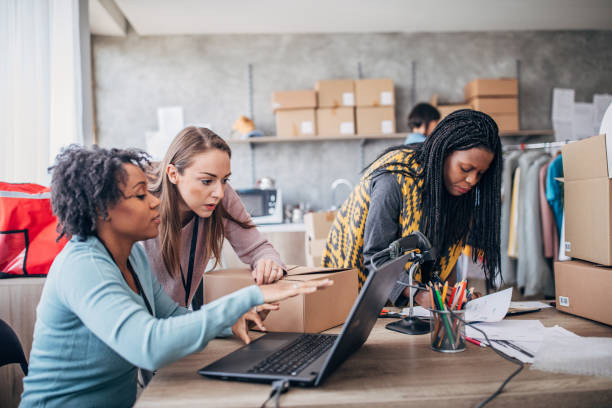 istock Diverse group of women arranging customers orders for drop shipping 1201432786