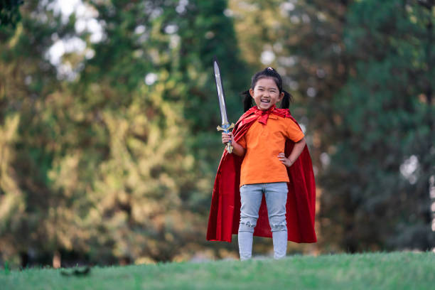 istock Wonder Girl Holding a Sword 1201433562