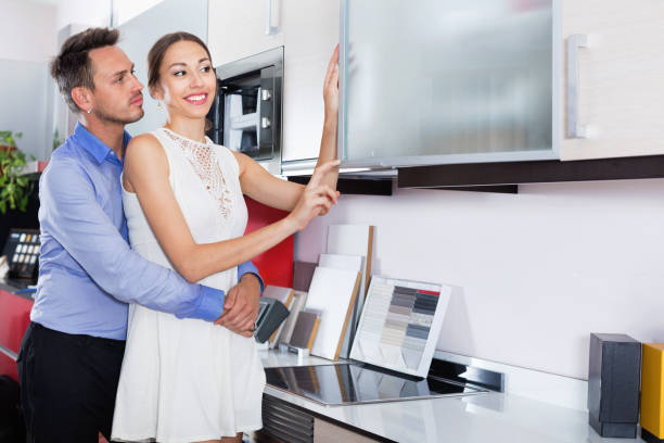 istock Couple choosing material for facades for their future kitchen 1201435848